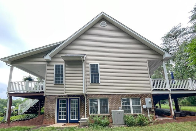 115 Armistead Ln, Rustburg, VA 24588 - back of property with a wooden deck, brick siding, and stairway