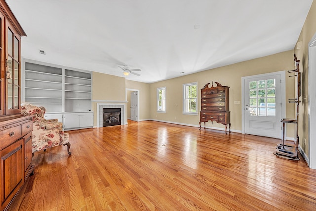 6820 Dawnwood Rd, Roanoke, VA 24018 - living room with a ceiling fan, light wood-style floors, and a tiled fireplace