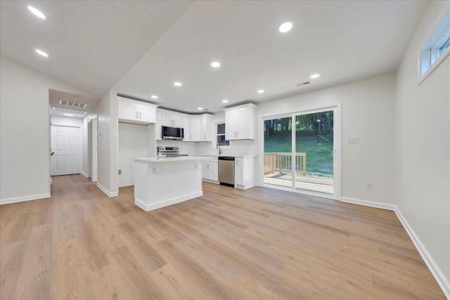 2315 Vale Ave, Roanoke, VA 24012 - kitchen with stainless steel appliances, white cabinets, light countertops, light wood-style floors, and recessed lighting