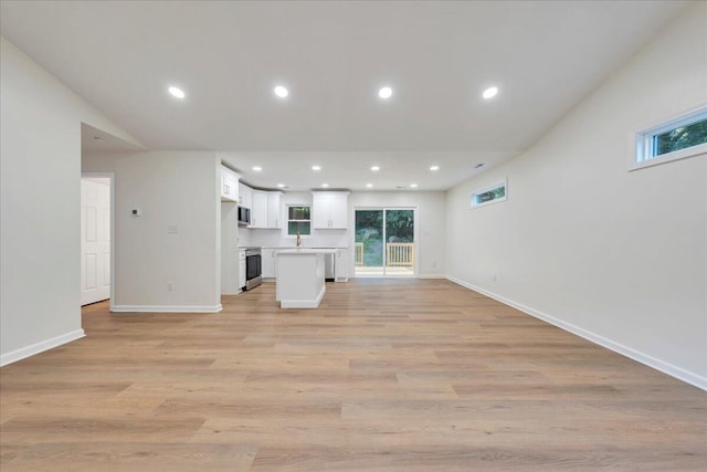 2315 Vale Ave, Roanoke, VA 24012 - unfurnished living room with plenty of natural light, light wood finished floors, and recessed lighting