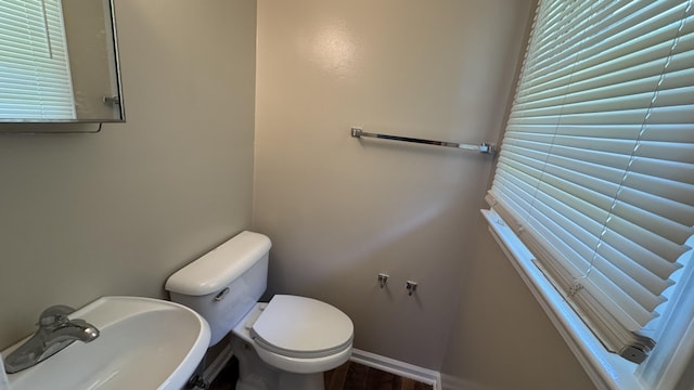 2315 Meadowbrook Rd NW, Roanoke, VA 24017 - half bathroom featuring a sink and wood finished floors
