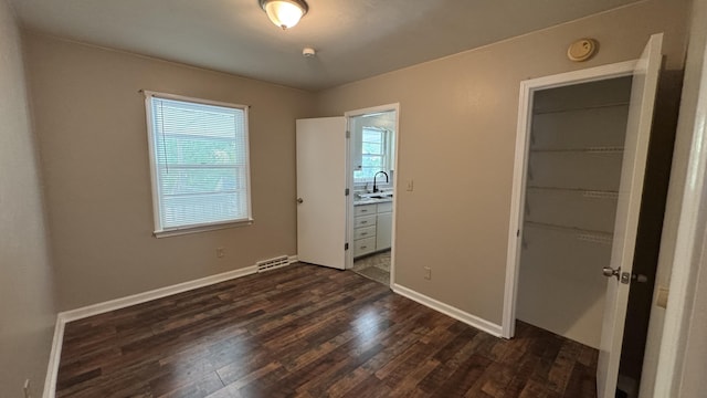 2315 Meadowbrook Rd NW, Roanoke, VA 24017 - unfurnished bedroom with dark wood-type flooring and a closet