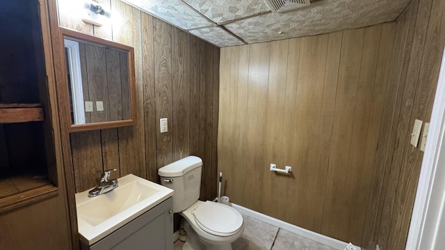2315 Meadowbrook Rd NW, Roanoke, VA 24017 - bathroom with wood walls, vanity, and tile patterned floors