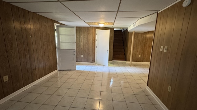 2315 Meadowbrook Rd NW, Roanoke, VA 24017 - unfurnished room with wood walls, stairway, light tile patterned floors, and a paneled ceiling
