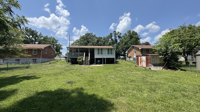 2315 Meadowbrook Rd NW, Roanoke, VA 24017 - back of property featuring a shed, a fenced backyard, stairs, and a sunroom