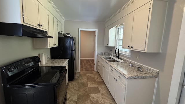 2315 Meadowbrook Rd NW, Roanoke, VA 24017 - kitchen featuring black appliances, under cabinet range hood, white cabinetry, ornamental molding, and light stone finish floors
