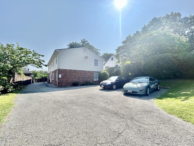 426 Walnut Ave SE, Roanoke, VA 24014 - view of property exterior featuring brick siding and uncovered parking