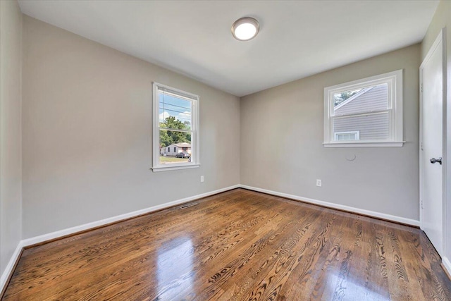 309 Mcclelland St, Salem, VA 24153 - spare room featuring wood finished floors and plenty of natural light
