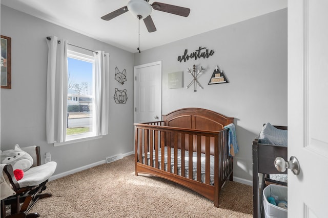 4575 Nelms Ln NE, Roanoke, VA 24019 - carpeted bedroom with a crib and a ceiling fan