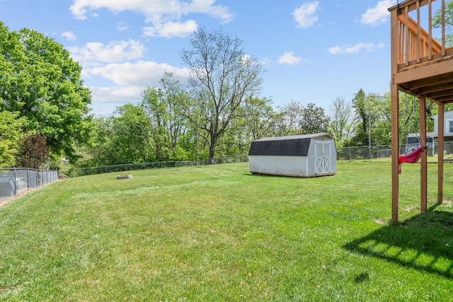 4575 Nelms Ln NE, Roanoke, VA 24019 - fenced backyard with a storage shed, a wooden deck, and view of wooded area