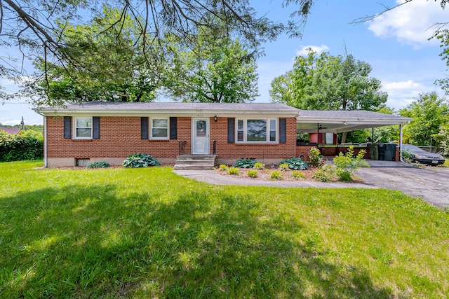 473 Hemlock Rd, Salem, VA 24153 - ranch-style house featuring a carport, brick siding, driveway, and a front lawn