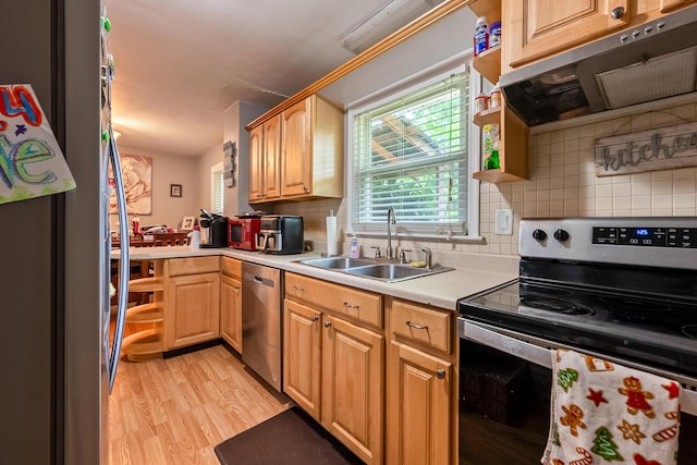 473 Hemlock Rd, Salem, VA 24153 - kitchen with appliances with stainless steel finishes, range hood, light wood finished floors, light countertops, and decorative backsplash