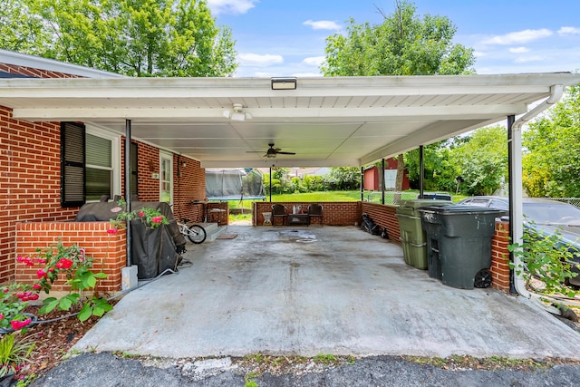473 Hemlock Rd, Salem, VA 24153 - view of patio / terrace with a trampoline, an attached carport, and ceiling fan