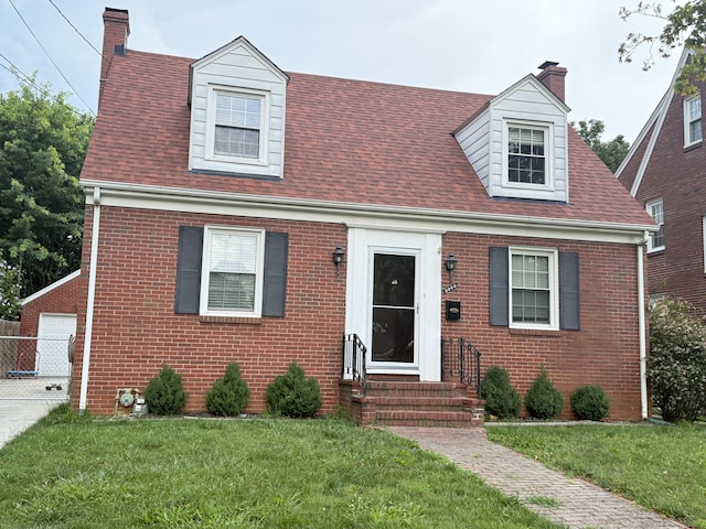 3303 Collingwood St NE, Roanoke, VA 24012 - cape cod home featuring brick siding, a chimney, entry steps, and a front lawn