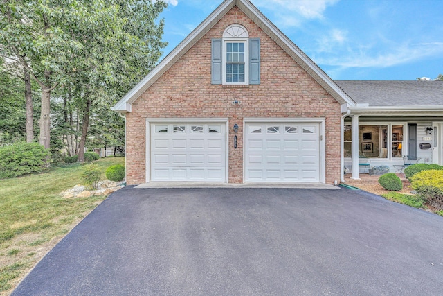1941 Springmill Rd, Salem, VA 24153 - view of front of home featuring asphalt driveway, a porch, a garage, brick siding, and a front yard