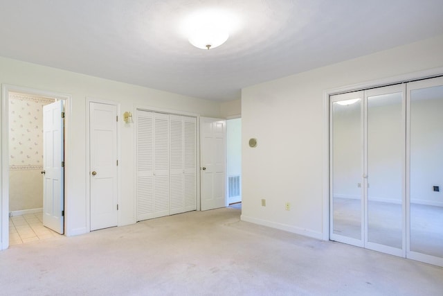 75 Eleanor Ln, Blue Ridge, VA 24064 - unfurnished bedroom with multiple closets, light colored carpet, and ensuite bathroom