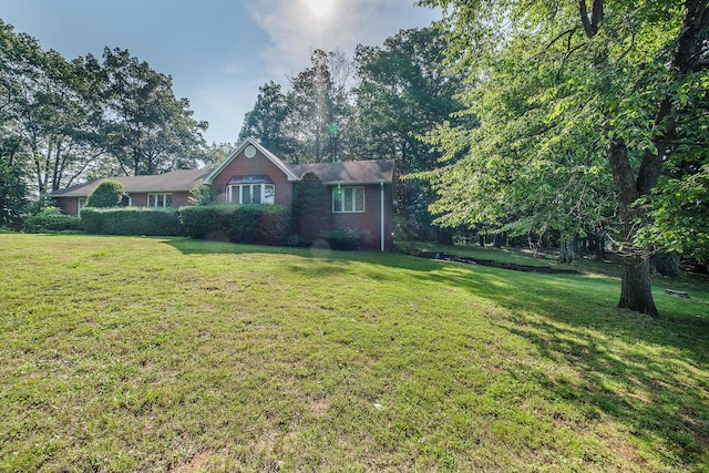 75 Eleanor Ln, Blue Ridge, VA 24064 - view of front facade featuring a front lawn and brick siding