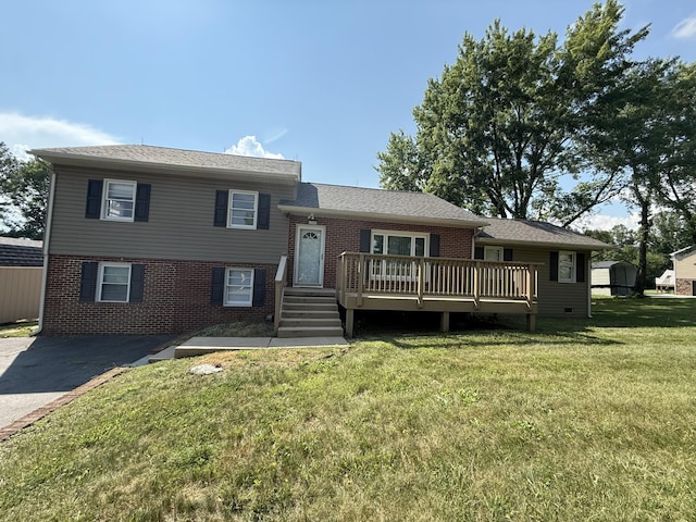 1250 Blacksburg Rd, Fincastle, VA 24090 - tri-level home with brick siding, a wooden deck, and a front lawn