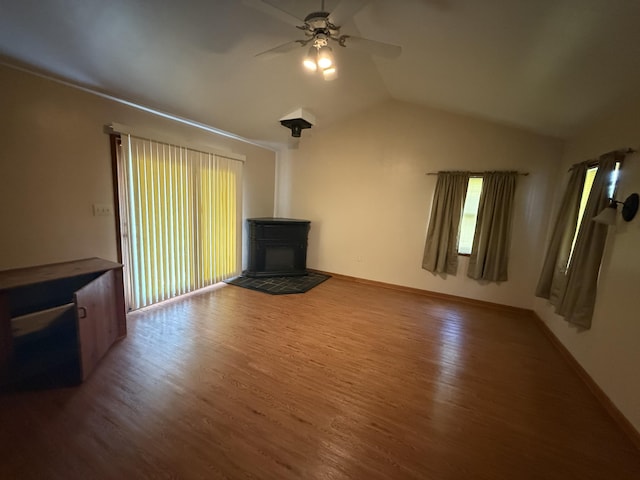 1250 Blacksburg Rd, Fincastle, VA 24090 - unfurnished living room with ceiling fan, wood finished floors, vaulted ceiling, healthy amount of natural light, and a fireplace