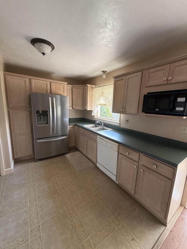 1250 Blacksburg Rd, Fincastle, VA 24090 - kitchen featuring stainless steel fridge, black microwave, white dishwasher, dark countertops, and a textured ceiling