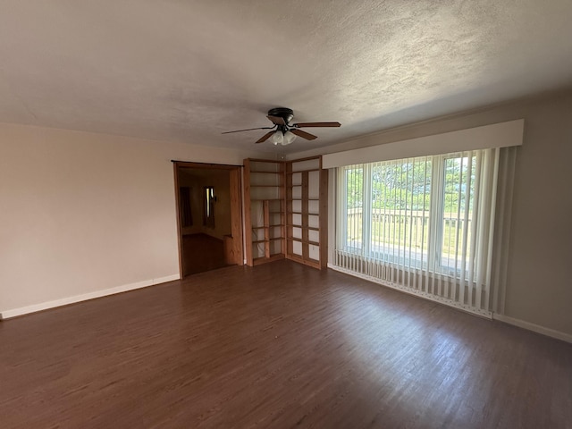 1250 Blacksburg Rd, Fincastle, VA 24090 - unfurnished living room featuring ceiling fan, dark wood finished floors, and a textured ceiling