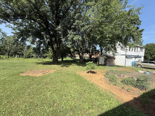 3124 Round Hill Ave NW, Roanoke, VA 24012 - view of grassy yard featuring a storage unit and an attached garage
