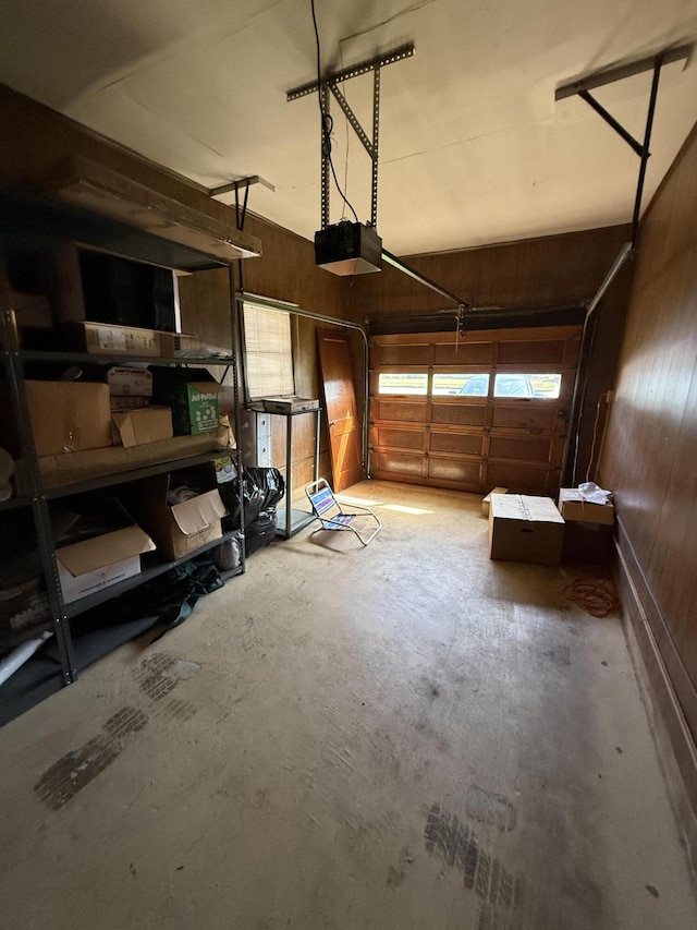 3124 Round Hill Ave NW, Roanoke, VA 24012 - garage featuring wooden walls and a garage door opener