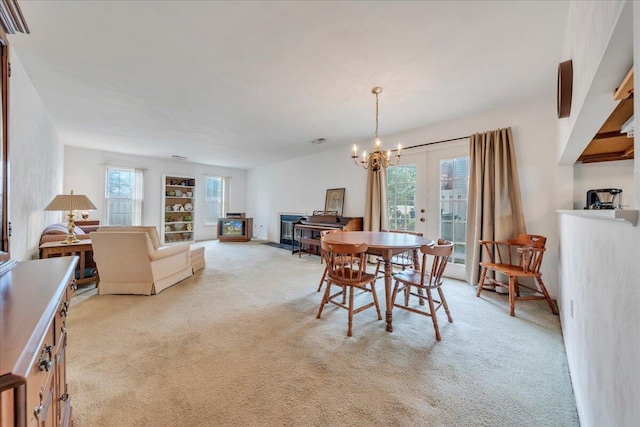 850 Stonegate Ct, Salem, VA 24153 - dining room featuring light carpet, french doors, and a chandelier