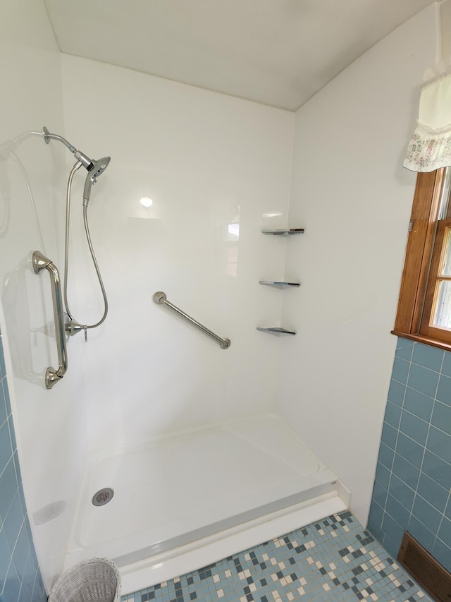 82 Twilight Ln, Glade Hill, VA 24092 - full bath featuring a shower, tile walls, and tile patterned floors