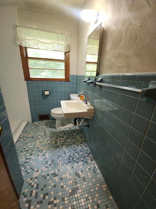 82 Twilight Ln, Glade Hill, VA 24092 - bathroom featuring tile patterned flooring, wainscoting, tile walls, and a shower