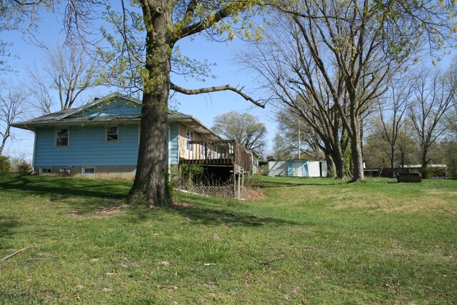 1312 N Lake Of The Wood Rd, Columbia, MO 65202 - view of yard featuring a deck