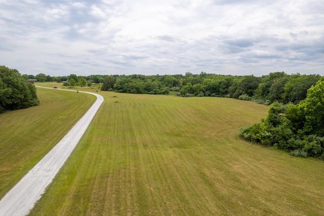 birds eye view of property with a rural view