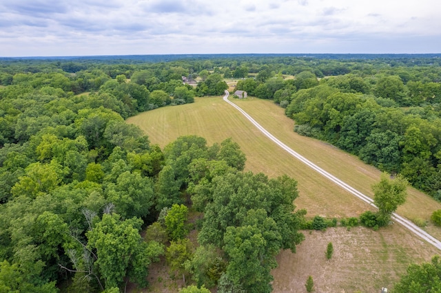 birds eye view of property with a rural view