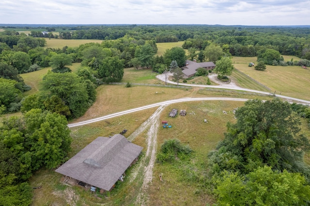 birds eye view of property with a rural view