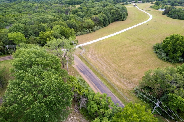 birds eye view of property with a rural view