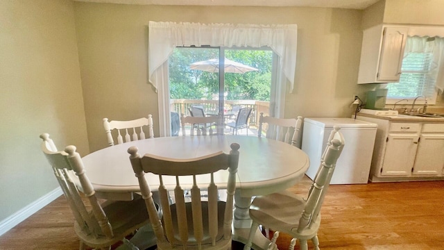 240 N Broadview Ct, Columbia, MO 65201 - dining area with light wood-style floors and baseboards