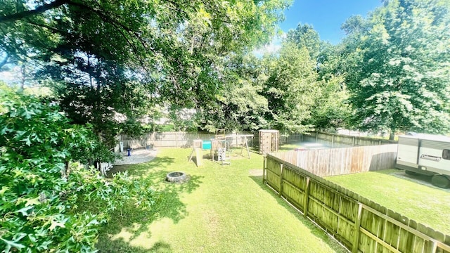 240 N Broadview Ct, Columbia, MO 65201 - fenced backyard featuring a fire pit