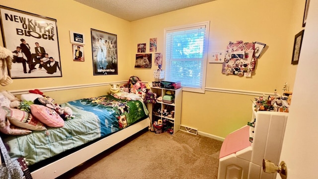 240 N Broadview Ct, Columbia, MO 65201 - bedroom featuring a textured ceiling and carpet floors