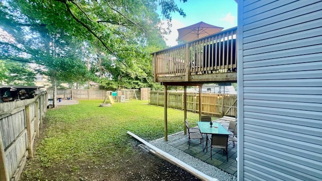240 N Broadview Ct, Columbia, MO 65201 - fenced backyard featuring a patio, a playground, a wooden deck, and outdoor dining area