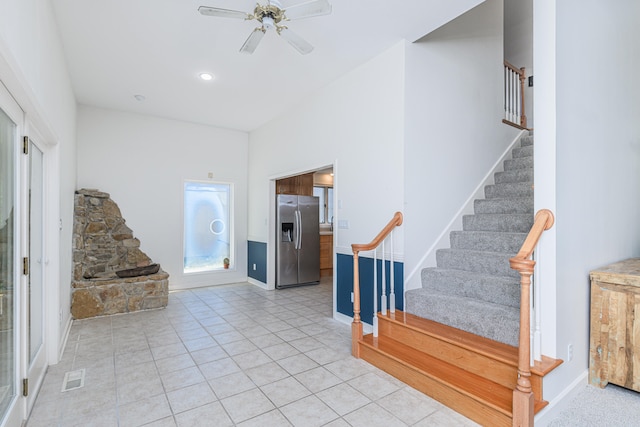 tiled foyer entrance featuring ceiling fan