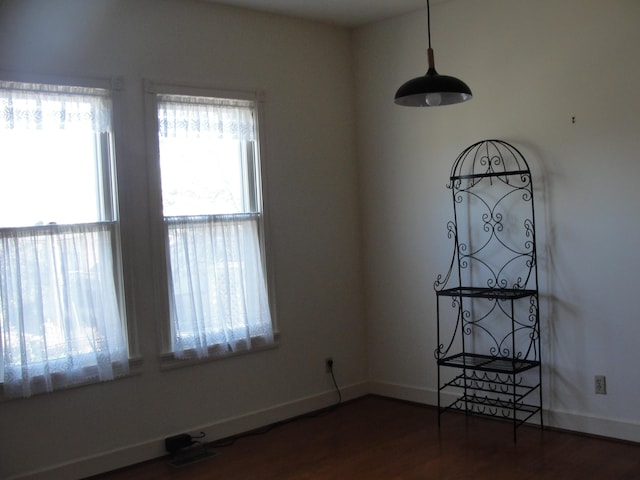 empty room featuring dark wood-type flooring