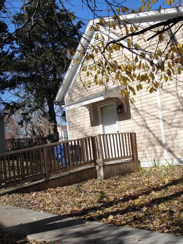 view of home's exterior featuring a wooden deck