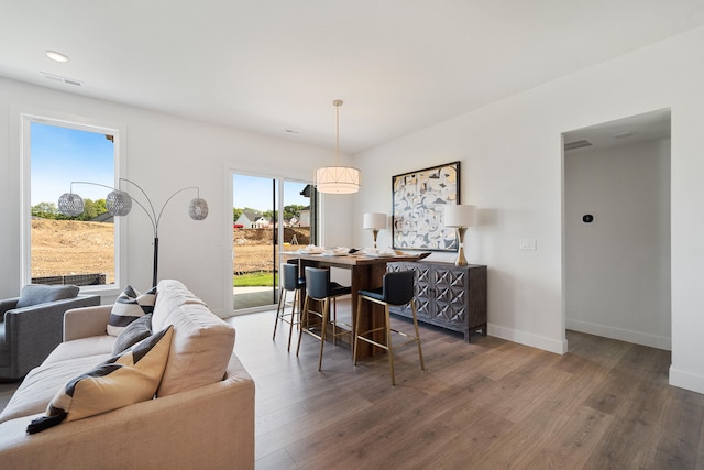 dining space with dark hardwood / wood-style floors