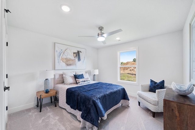 bedroom featuring light carpet and ceiling fan