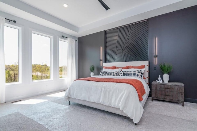 bedroom with light carpet and ceiling fan