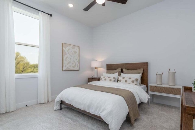 bedroom with light carpet and ceiling fan