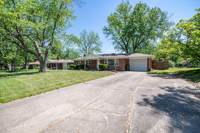 single story home with a garage, brick siding, and driveway