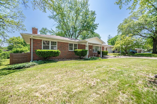 ranch-style house featuring a chimney, brick siding, and a front lawn