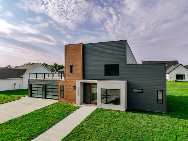 contemporary house with a garage and a front yard