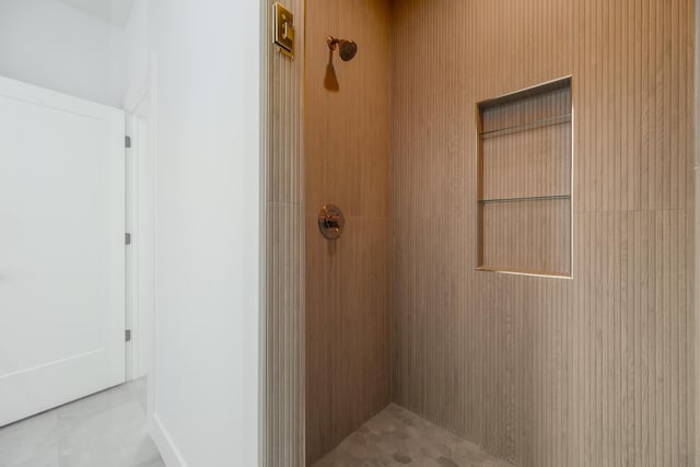 bathroom with tiled shower